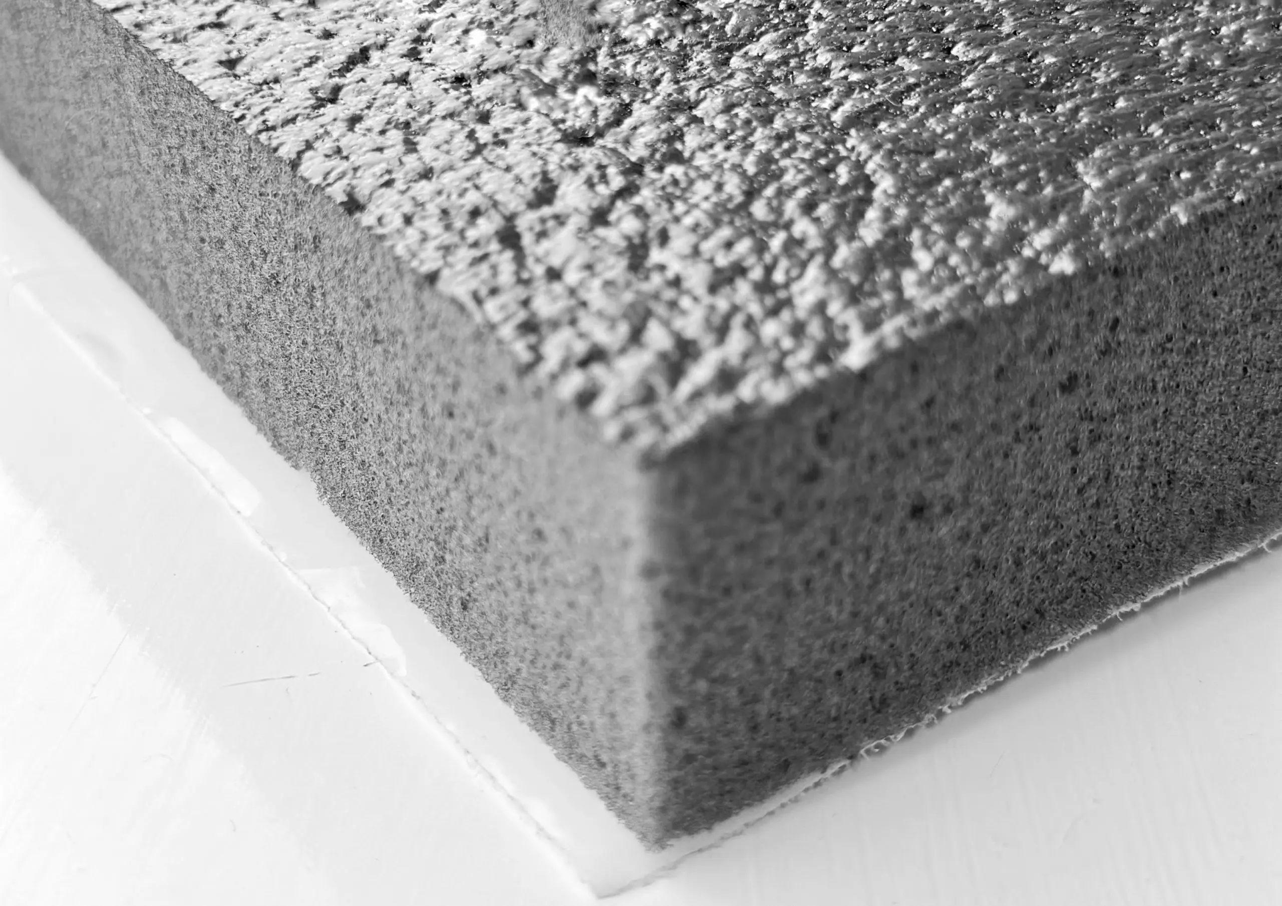 Composite foam block, resembling cake, engineered to offer a remarkable blend of strength, durability, and versatility