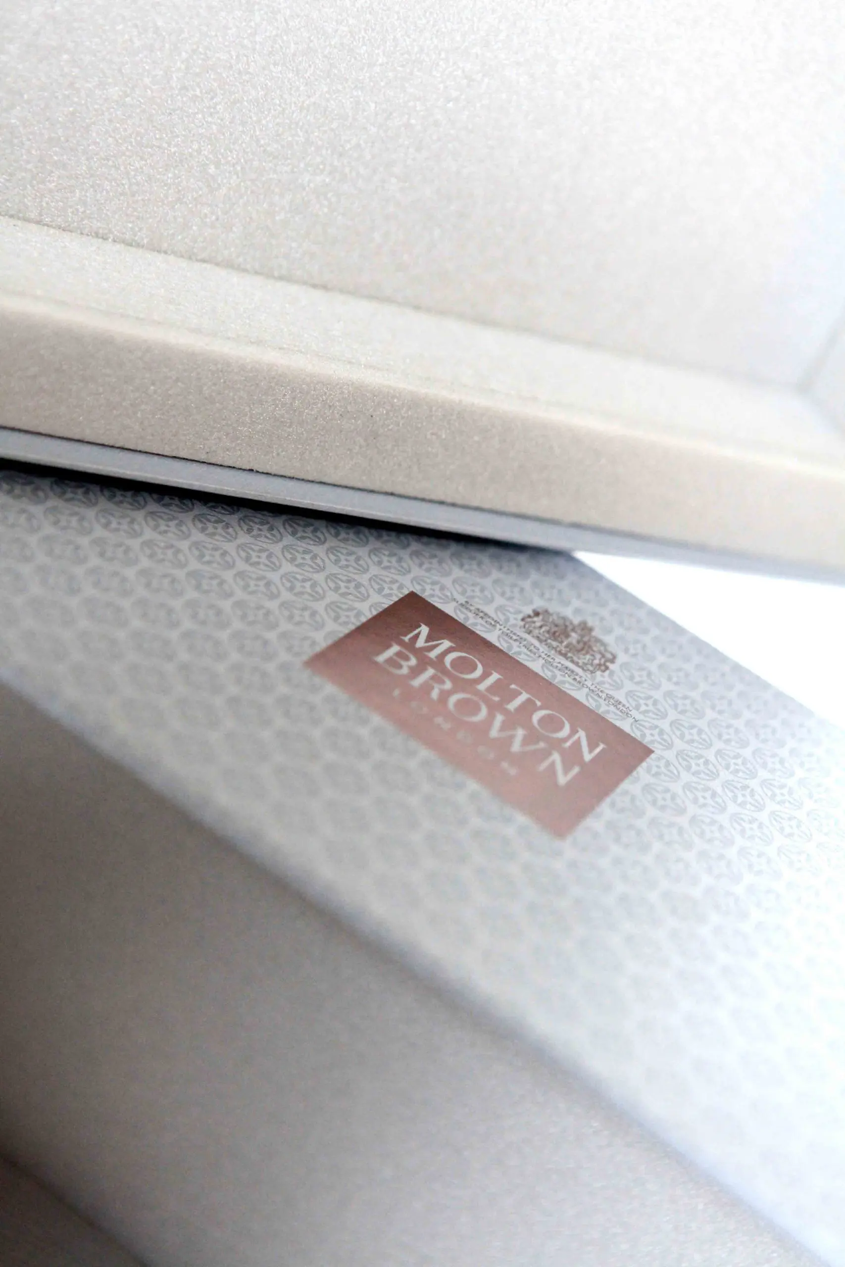Molton Brown box with foam insert. luxury product dosplay, product protection.